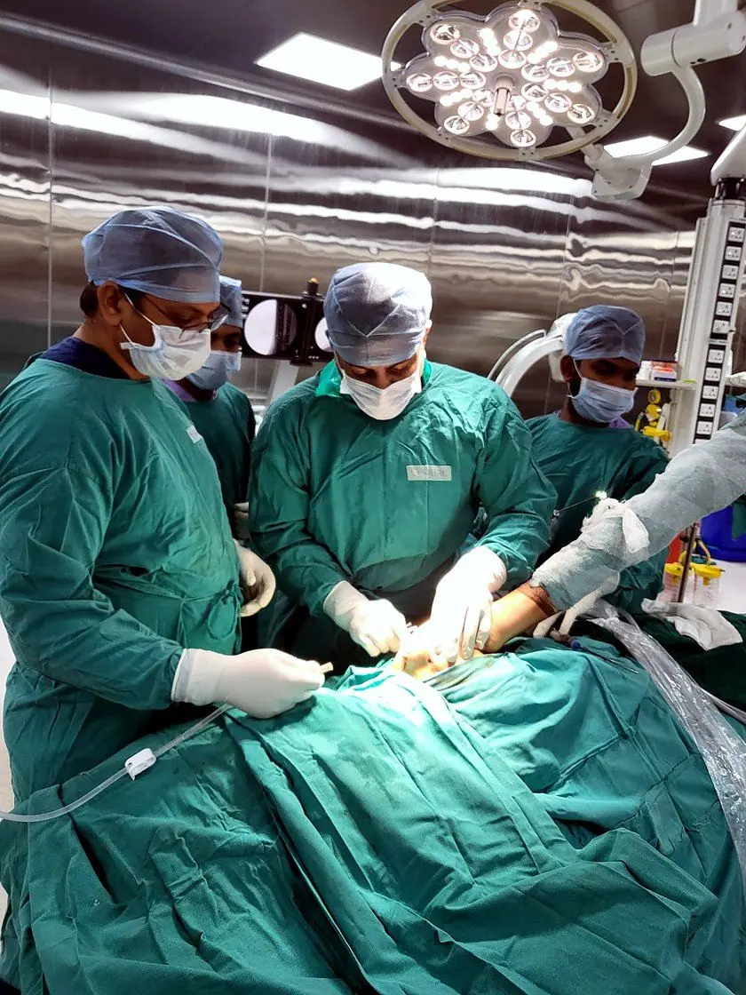 Surgeons working under the theatre light during an arthroscopic procedure